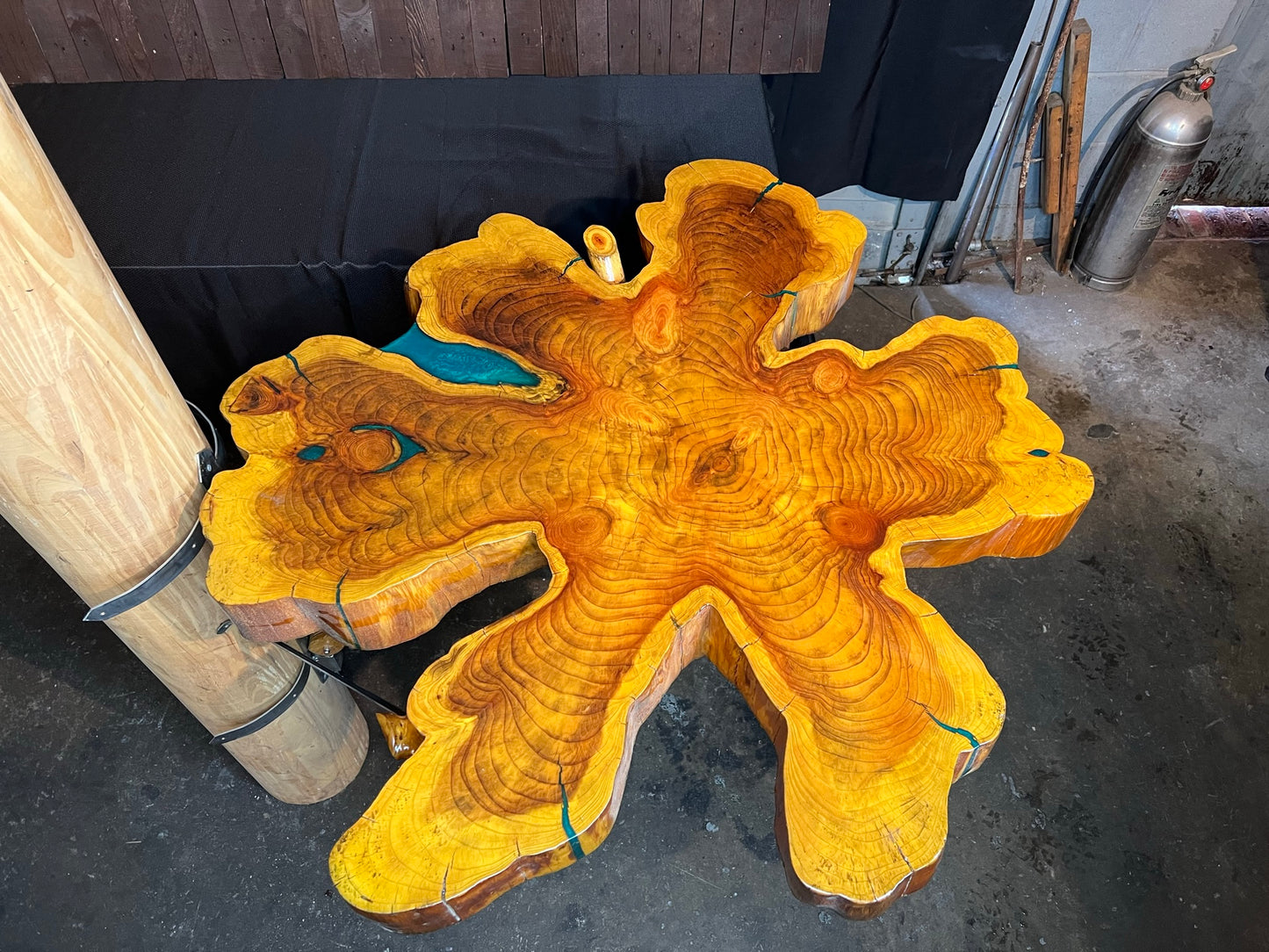 "One-of-a-kind" live edge table with a custom mount.