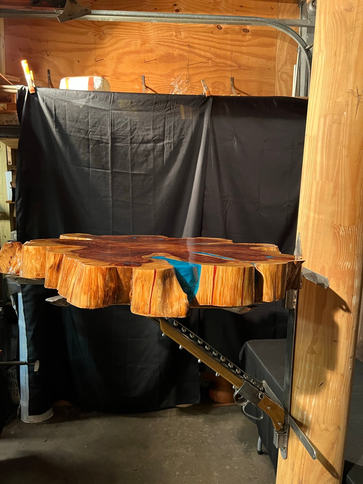 "One-of-a-kind" live edge table with a custom mount.