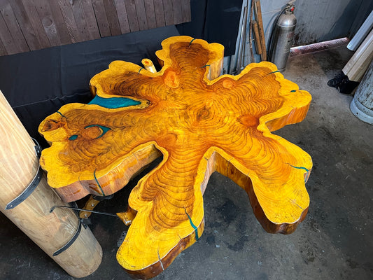 "One-of-a-kind" live edge table with a custom mount.