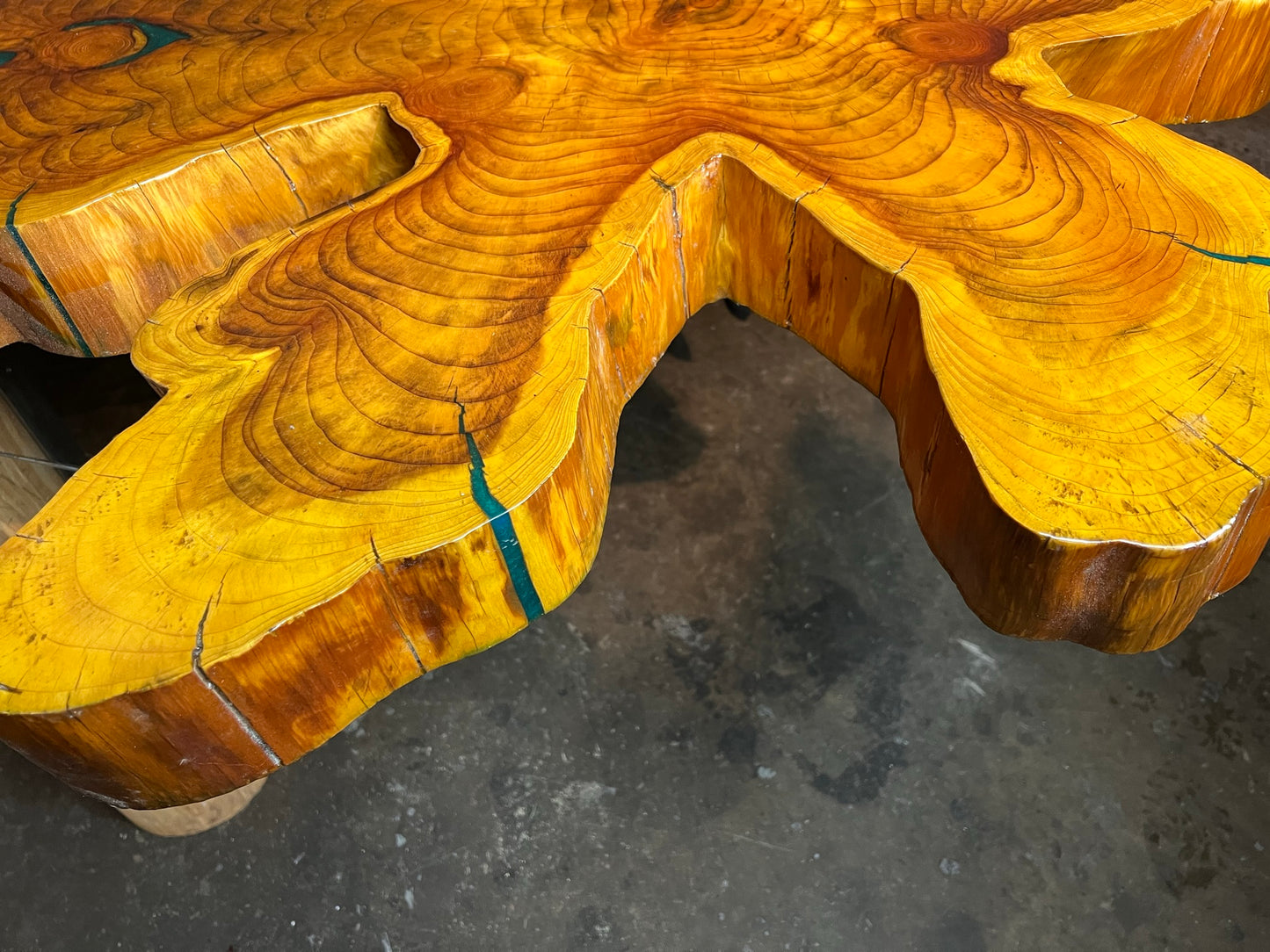 "One-of-a-kind" live edge table with a custom mount.